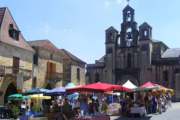 Market stalls in the square at Villefranche-du-Perigord